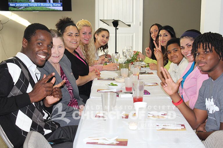 World Mission Society Church of God members and guests at the table during 2015 Mother's Day dinner in Louisville, KY