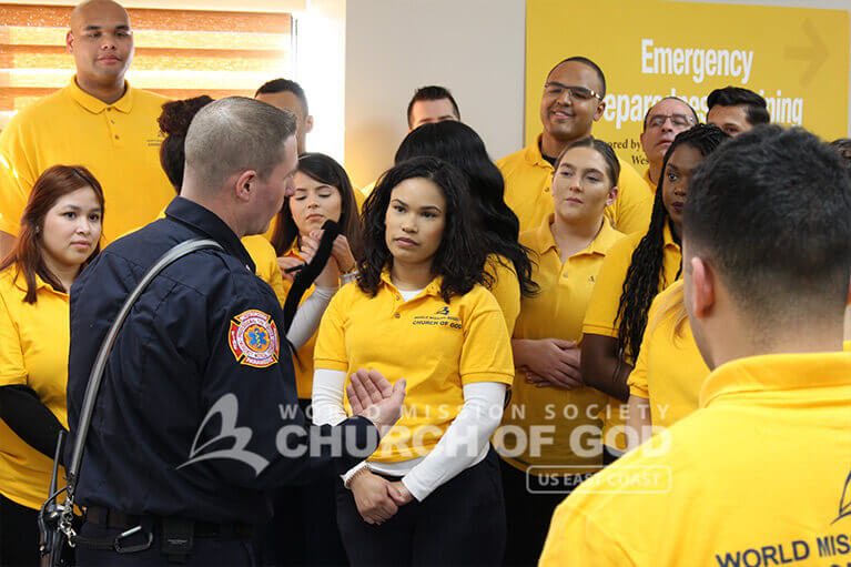Fire Department representative instructing participants on procedures for stopping the bleeding of victims