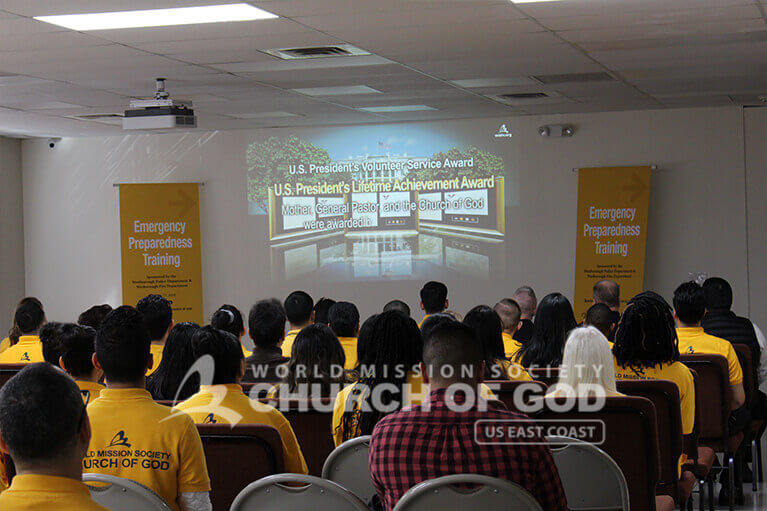 Emergency Preparedness Training attendees watching the Church of God intro video