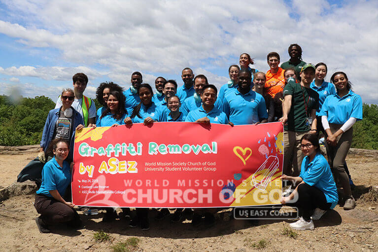 Group shot of ASEZ volunteers during the graffiti removal project at the Cranberry Lake Preserve