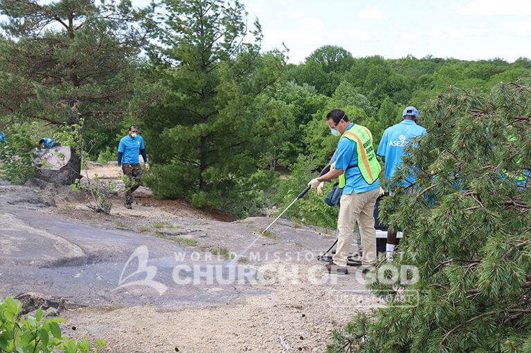 ASEZ volunteers removing graffiti at the Cranberry Lake Preserve in North White Plains, NY