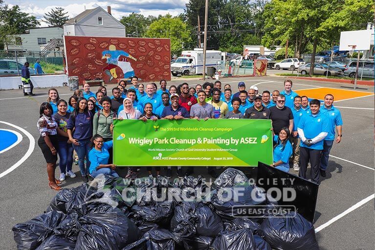 Group photo of ASEZ student volunteers during their Wrigley Park cleanup in Paterson, NJ.
